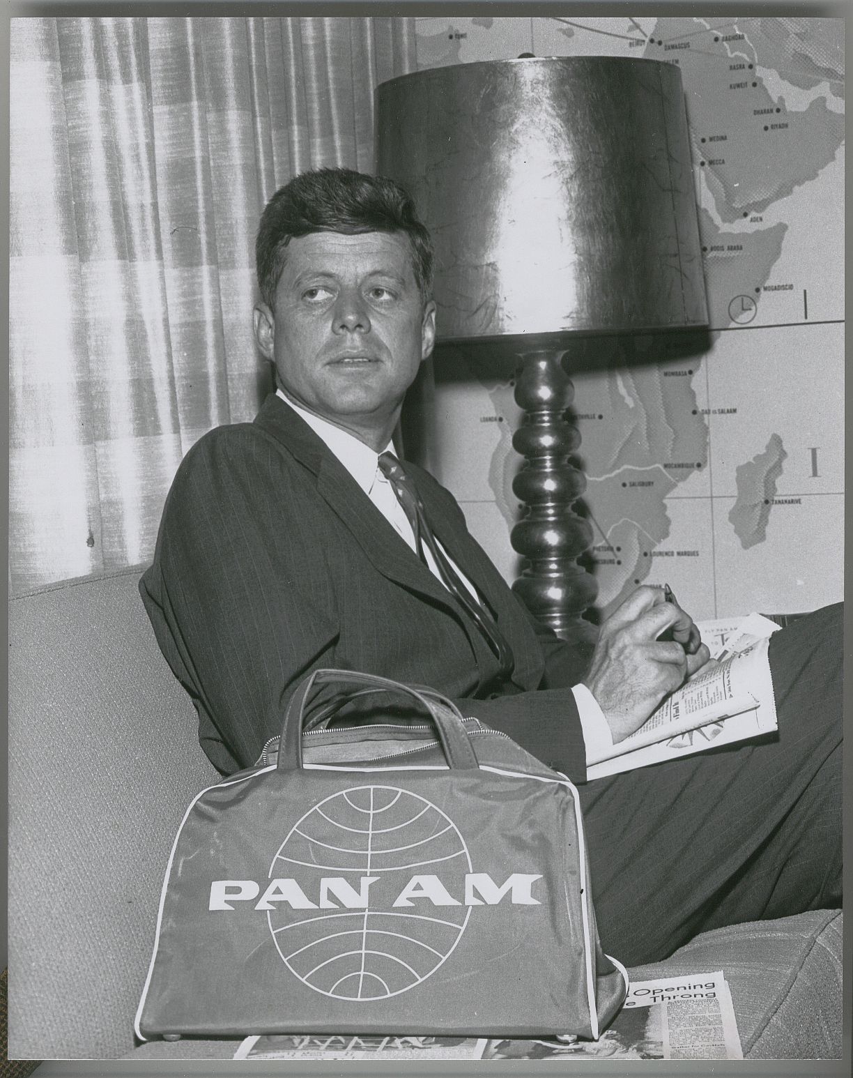 1959 Senator John F. Kennedy relaxes in a Pan Am Clipper Club prior to his flight.